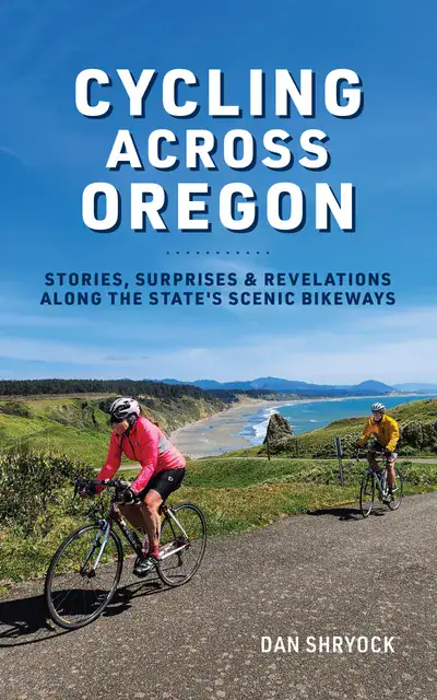 Book cover image of Dan Shryock's book, "Cycling Across Oregon: Stories, Surprises, & Revelations Along the State's Scenic Bikeways." Picturing two cyclists riding along the Oregon coast.